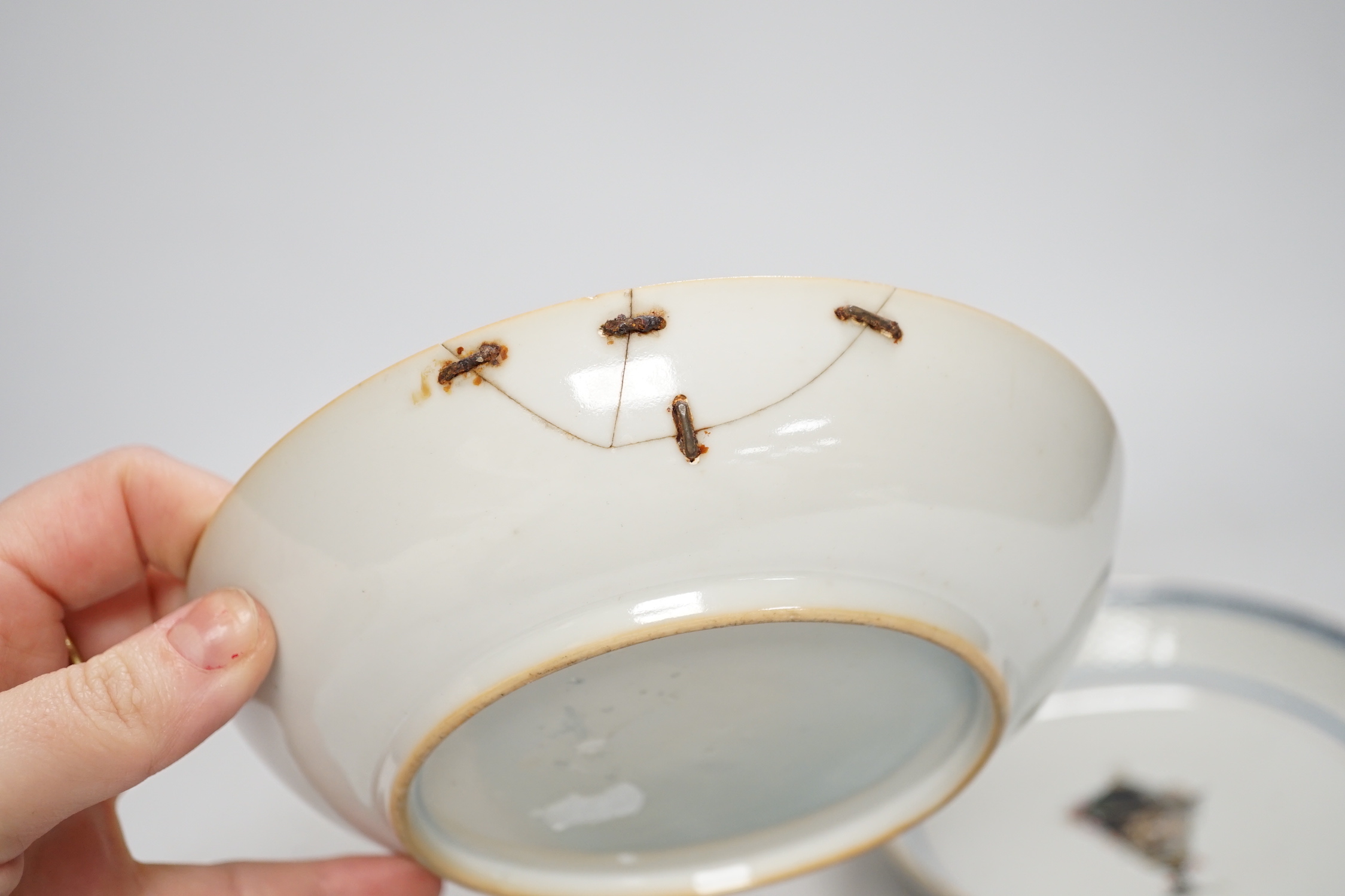 A Chinese turquoise glazed saucer dish, Qianlong Mark and period and two Chinese export famille rose saucers, Qianlong period, 16cm diameter
